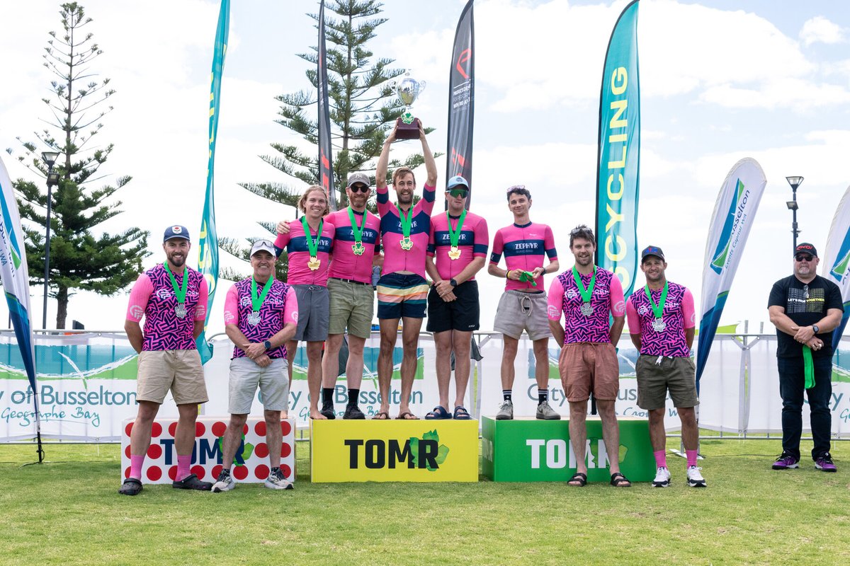 On Form Physio team at a cycling event podium