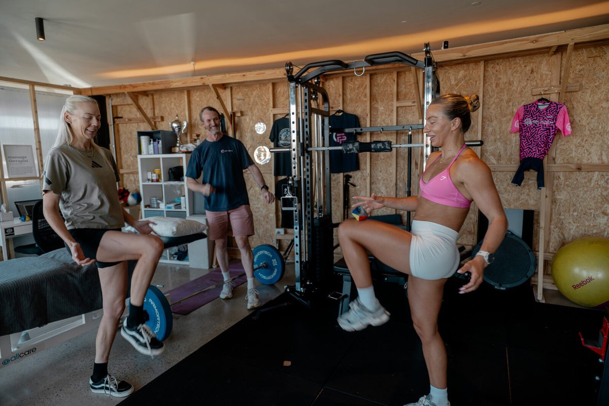 Physiotherapist coaching a small-group Performance Physiotherapy session at On Form Physio